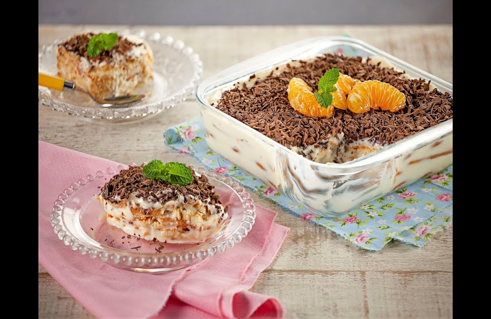 Ir para  <p>1 lata de condensado;</p>

<p>3 colheres (sopa) de suco de tangerina;</p>

<p>raspas da casca de 1 tangerina;</p>

<p>1 caixinha de Creme de...
